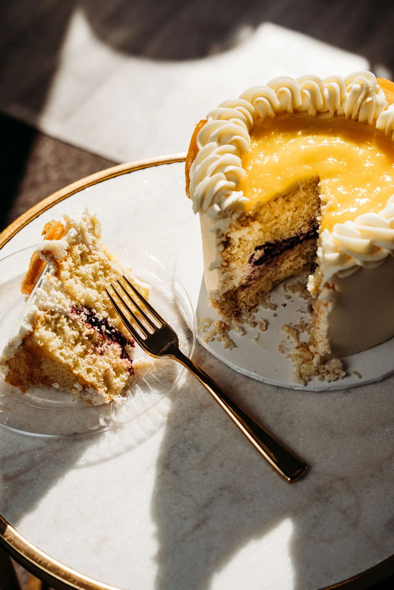 Cake slice with lemon curd and cream